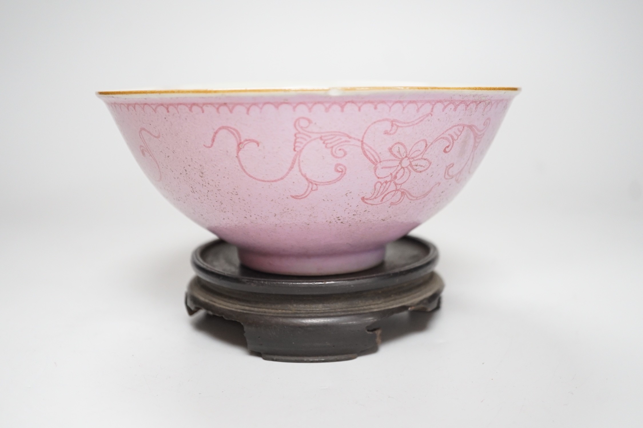 An early 19th century? Chinese powder pink ground export porcelain bowl, 17cm (a.f.), on associated pierced carved hardwood stand